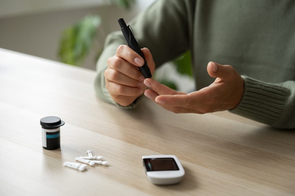 Person-holds-pen-and-small-electronic-device-symbolizing-diabetes-management-and-consultation-in-Indore.jpg